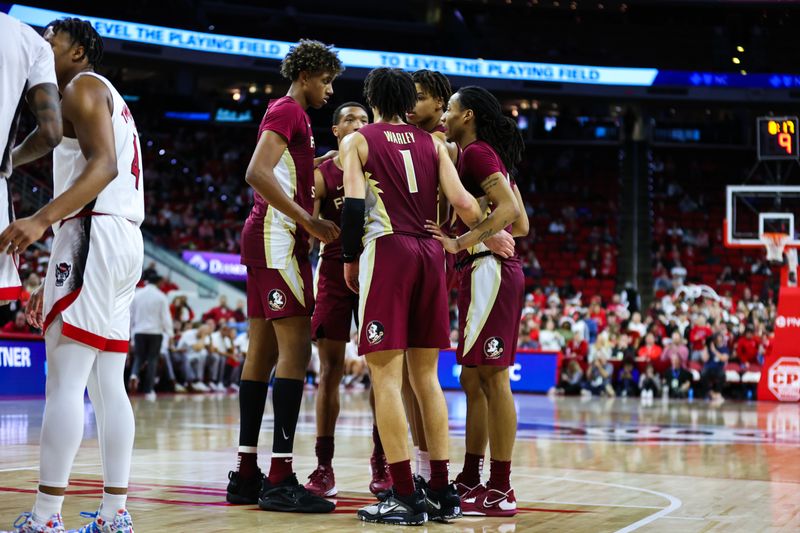 Feb 1, 2023; Raleigh, North Carolina, USA; Florida State Seminoles guard Jalen Warley (1) huddles with the rest of his teammates during the second half against the North Carolina State Wolfpack at PNC Arena.  Mandatory Credit: Jaylynn Nash-USA TODAY Sports