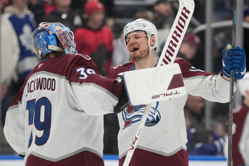Jan 25, 2026; Toronto, Ontario, CAN; Colorado Avalanche forward Valeri Nichushkin (13) congratulates goaltender MacKenzie Blackwood (39) after a win over the Toronto Maple Leafs at Scotiabank Arena. Mandatory Credit: John E. Sokolowski-Imagn Images