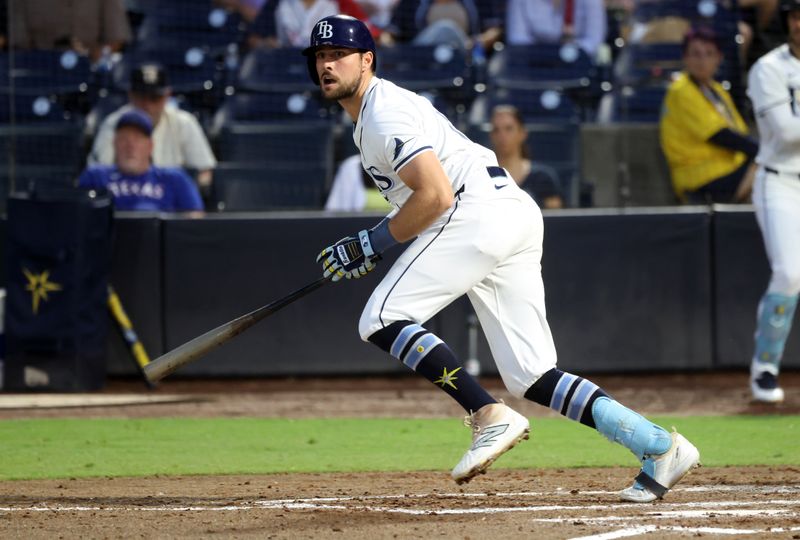 Jun 4, 2025; St. Petersburg, Florida, USA;  Tampa Bay Rays outfielder Josh Lowe (15) hits an RBI double during the third inning against the Texas Rangers at George M. Steinbrenner Field. Mandatory Credit: Kim Klement Neitzel-Imagn Images
