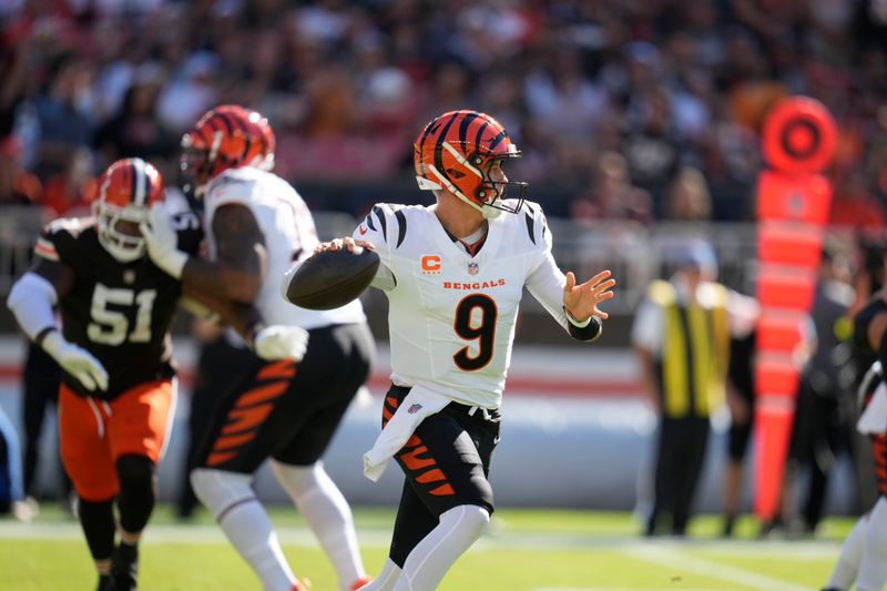 Cincinnati Bengals quarterback Joe Burrow (9) looks to pass in the first half of an NFL football game against the Cleveland Browns, Sunday, Oct. 20, 2024, in Cleveland. (AP Photo/Sue Ogrocki)