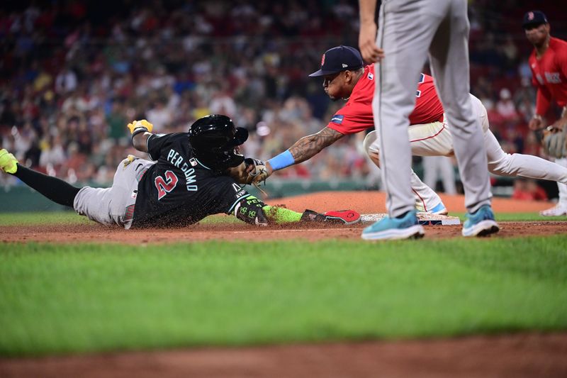 Aug 23, 2024; Boston, Massachusetts, USA; Arizona Diamondbacks shortstop Geraldo Perdomo (2) slides into third base against Boston Red Sox shortstop Ceddanne Rafaela (43) during the ninth inning at Fenway Park. Mandatory Credit: Eric Canha-USA TODAY Sports