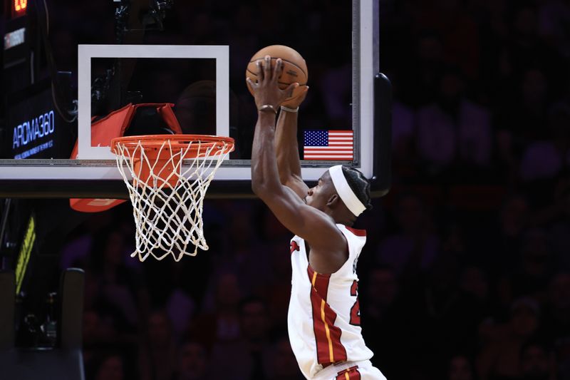 MIAMI, FLORIDA - OCTOBER 23: Jimmy Butler #22 of the Miami Heat dunks the ball against the Orlando Magic during the second half at Kaseya Center on October 23, 2024 in Miami, Florida. NOTE TO USER: User expressly acknowledges and agrees that, by downloading and or using this photograph, User is consenting to the terms and conditions of the Getty Images License Agreement. (Photo by Carmen Mandato/Getty Images)