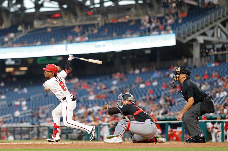 Sep 12, 2024; Washington, District of Columbia, USA; Washington Nationals third baseman José Tena (8) hits a two run double against the Miami Marlins during the first inning at Nationals Park. Mandatory Credit: Geoff Burke-Imagn Images