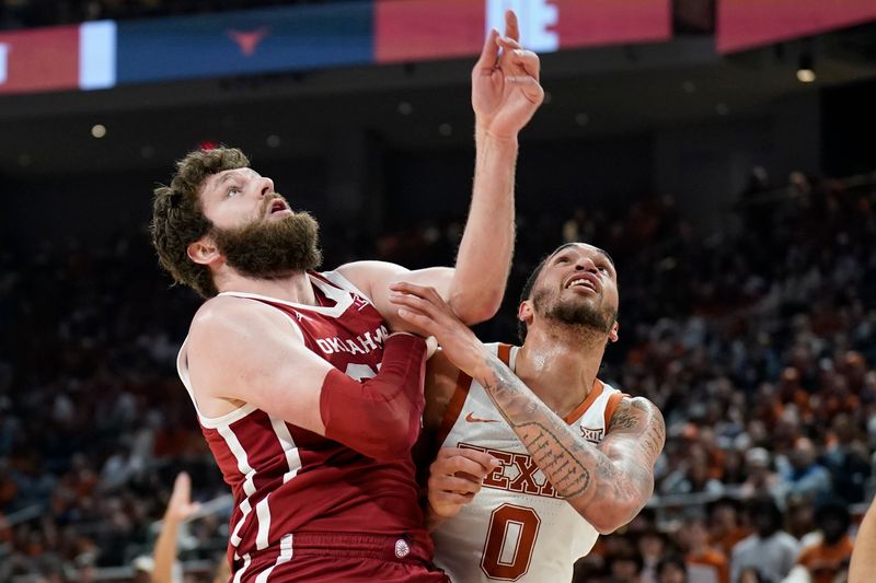 Feb 18, 2023; Austin, Texas, USA; Oklahoma Sooners forward Tanner Groves (35) and Texas Longhorns forward Timmy Allen (0) box each other out for a rebound during the first half at Moody Center. Mandatory Credit: Scott Wachter-USA TODAY Sports