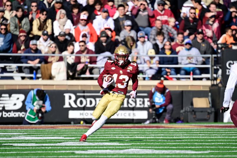 Nov 11, 2023; Chestnut Hill, Massachusetts, USA; Boston College Eagles wide receiver Dino Tomlin (13) runs the ball during the first half against the Virginia Tech Hokies at Alumni Stadium. Mandatory Credit: Eric Canha-USA TODAY Sports