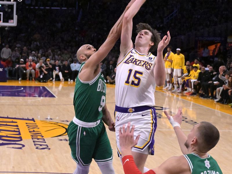 LOS ANGELES, CALIFORNIA - DECEMBER 25: Derrick White #9 of the Boston Celtics defends Austin Reaves #15 of the Los Angeles Lakers in the second half at Crypto.com Arena on December 25, 2023 in Los Angeles, California. NOTE TO USER: User expressly acknowledges and agrees that, by downloading and or using this photograph, User is consenting to the terms and conditions of the Getty Images License Agreement.(Photo by Jayne Kamin-Oncea/Getty Images)