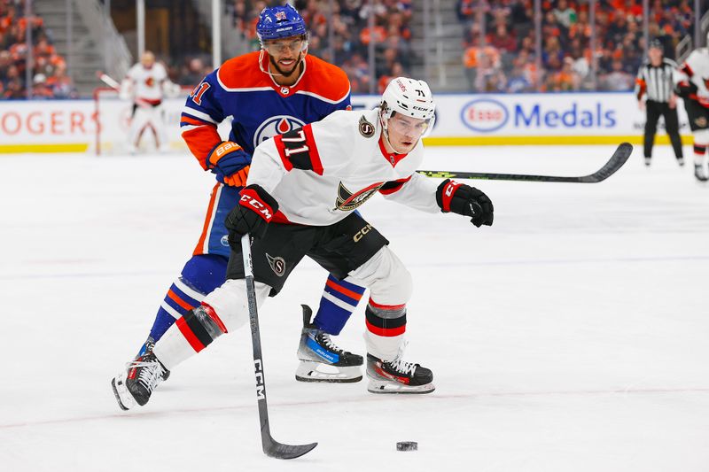 Jan 6, 2024; Edmonton, Alberta, CAN; Ottawa Senators forward Ridly Greig (71) carries the puck around Edmonton Oilers forward Evander Kane (91) during the second period at Rogers Place. Mandatory Credit: Perry Nelson-USA TODAY Sports