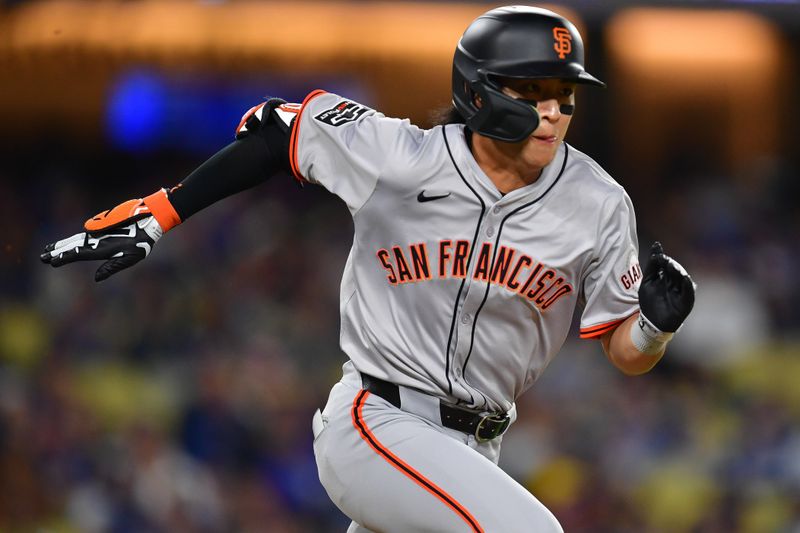 Apr 3, 2024; Los Angeles, California, USA; San Francisco Giants center fielder Jung Hoo Lee (51) runs out a ground ball against the Los Angeles Dodgers during the eighth inning at Dodger Stadium. Mandatory Credit: Gary A. Vasquez-USA TODAY Sports