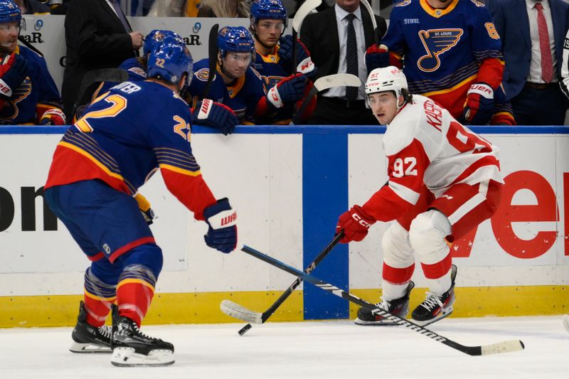 Apr 1, 2025; St. Louis, Missouri, USA; Detroit Red Wings center Marco Kasper (92) skates against St. Louis Blues defenseman Ryan Suter (22) during the first period at Enterprise Center. Mandatory Credit: Jeff Le-Imagn Images