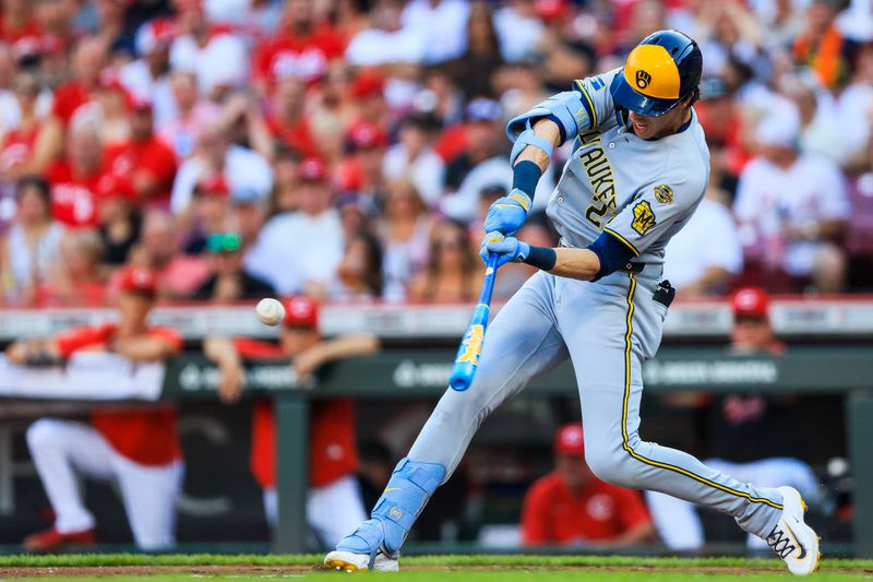 Aug 16, 2025; Cincinnati, Ohio, USA; Milwaukee Brewers designated hitter Christian Yelich (22) bats against the Cincinnati Reds in the second inning at Great American Ball Park. Mandatory Credit: Katie Stratman-Imagn Images