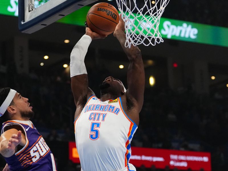 OKLAHOMA CITY, OK - FEBRUARY 5:  Luguentz Dort #5 of the Oklahoma City Thunder dunks the ball during the game against the Phoenix Suns  on February 5, 2025 at Paycom Center in Oklahoma City, Oklahoma. NOTE TO USER: User expressly acknowledges and agrees that, by downloading and or using this photograph, User is consenting to the terms and conditions of the Getty Images License Agreement. Mandatory Copyright Notice: Copyright 2025 NBAE (Photo by Cooper Neill/NBAE via Getty Images)