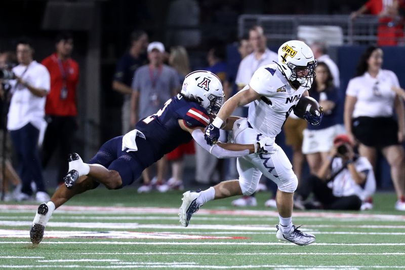 Sep 2, 2023; Tucson, Arizona, USA; Arizona Wildcats cornerback Treydan Stukes (2) makes a tackle against Northern Arizona Lumberjacks running back Draycen Hall (8) during the first half at Arizona Stadium. Mandatory Credit: Zac BonDurant-USA TODAY Sports