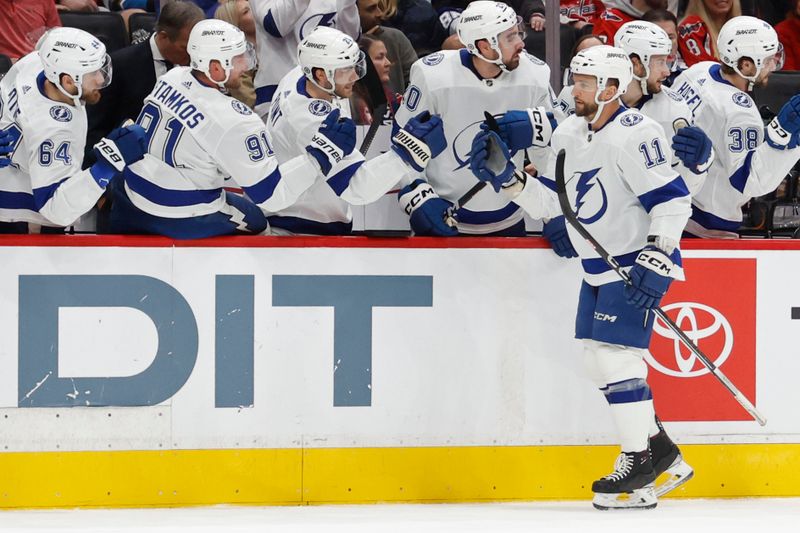 Dec 23, 2023; Washington, District of Columbia, USA; Tampa Bay Lightning center Luke Glendening (11) celebrates with teammates after scoring a goal against the Washington Capitals in the first period at Capital One Arena. Mandatory Credit: Geoff Burke-USA TODAY Sports