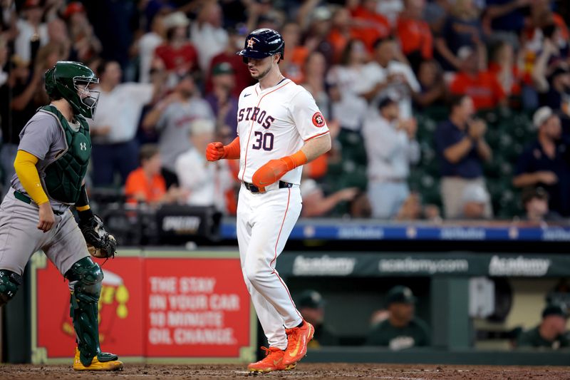 Sep 12, 2024; Houston, Texas, USA; Houston Astros designated hitter Kyle Tucker (30) crosses home plate to score a run against the Oakland Athletics during the eighth inning at Minute Maid Park. Mandatory Credit: Erik Williams-Imagn Images