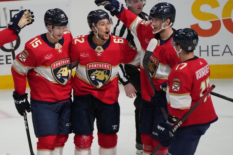 Feb 20, 2024; Sunrise, Florida, USA; Florida Panthers defenseman Brandon Montour (62) celebrates scoring a goal with teammates against the Ottawa Senators during the second period at Amerant Bank Arena. Mandatory Credit: Jim Rassol-USA TODAY Sports