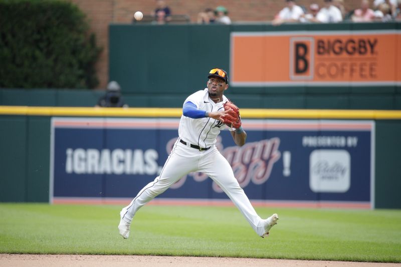 Jul 23, 2023; Detroit, Michigan, USA; Detroit Tigers infielder Andy Ibanez (77) throws the ball infield during the seventh inning at Comerica Park. Mandatory Credit: Brian Bradshaw Sevald-USA TODAY Sports