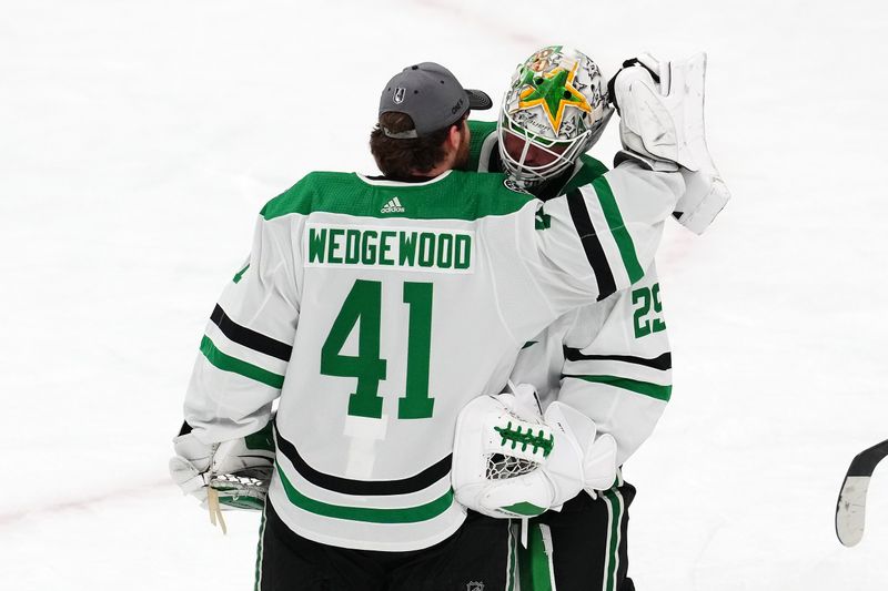 Apr 29, 2024; Las Vegas, Nevada, USA; Dallas Stars goaltender Scott Wedgewood (41) congratulates Dallas Stars goaltender Jake Oettinger (29) after the Stars defeated the Vegas Golden Knights 4-2 in game four of the first round of the 2024 Stanley Cup Playoffs at T-Mobile Arena. Mandatory Credit: Stephen R. Sylvanie-USA TODAY Sports