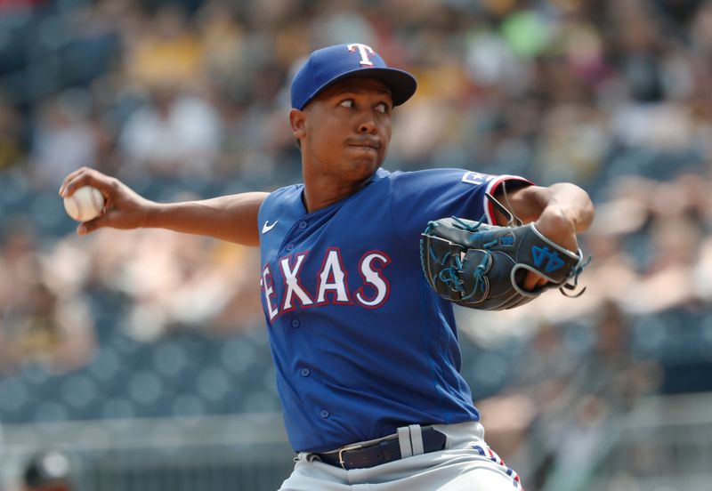 May 24, 2023; Pittsburgh, Pennsylvania, USA; Texas Rangers relief pitcher Jose Leclerc (25) pitches against the Pittsburgh Pirates during the eighth inning at PNC Park. Texas won 3-2. Mandatory Credit: Charles LeClaire-USA TODAY Sports