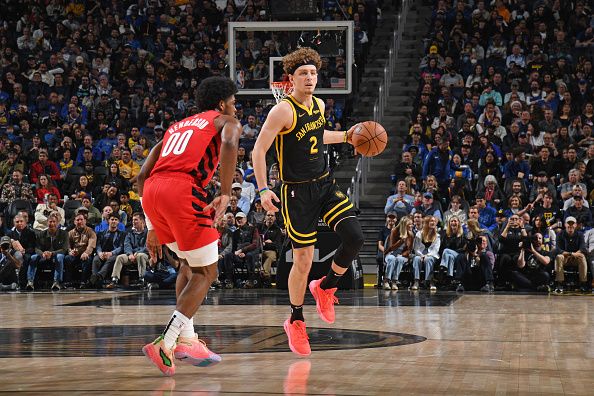 SAN FRANCISCO, CA - DECEMBER 23: Brandin Podziemski #2 of the Golden State Warriors dribbles the ball during the game against the Portland Trail Blazers on December 23, 2023 at Chase Center in San Francisco, California. NOTE TO USER: User expressly acknowledges and agrees that, by downloading and or using this photograph, user is consenting to the terms and conditions of Getty Images License Agreement. Mandatory Copyright Notice: Copyright 2023 NBAE (Photo by Noah Graham/NBAE via Getty Images)