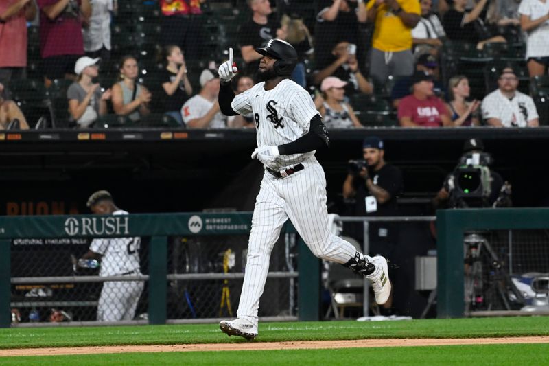 Aug 24, 2023; Chicago, Illinois, USA; Chicago White Sox center fielder Luis Robert Jr. (88) points after he hits a two run home run against the Oakland Athletics during the fifth inning at Guaranteed Rate Field. Mandatory Credit: Matt Marton-USA TODAY Sports