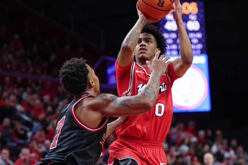 Jan 23, 2026; Piscataway, New Jersey, USA; Rutgers Scarlet Knights guard Tariq Francis (0) shoots the ball against Indiana Hoosiers forward Nick Dorn (7) during the second half at Jersey Mike's Arena. Mandatory Credit: Vincent Carchietta-Imagn Images