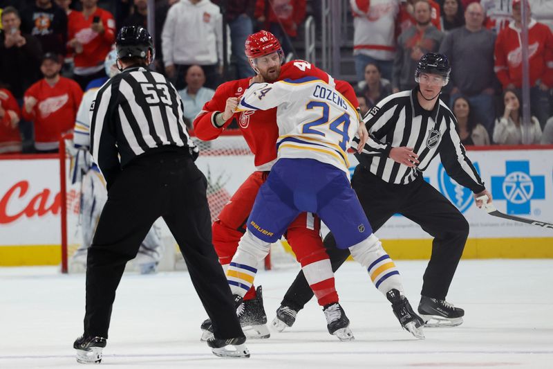 Apr 7, 2024; Detroit, Michigan, USA; Detroit Red Wings defenseman Jeff Petry (46) and Buffalo Sabres center Dylan Cozens (24) fight in the first period at Little Caesars Arena. Mandatory Credit: Rick Osentoski-USA TODAY Sports