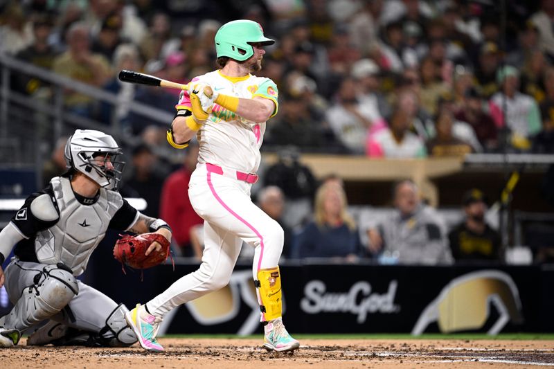 Sep 20, 2024; San Diego, California, USA; San Diego Padres second baseman Jake Cronenworth (9) hits a single against the Chicago White Sox during the third inning at Petco Park. Mandatory Credit: Orlando Ramirez-Imagn Images