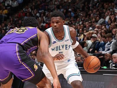 MINNEAPOLIS, MN -  DECEMBER 30: Anthony Edwards #5 of the Minnesota Timberwolves looks on during the game against the Los Angeles Lakers on December 30, 2023 at Target Center in Minneapolis, Minnesota. NOTE TO USER: User expressly acknowledges and agrees that, by downloading and or using this Photograph, user is consenting to the terms and conditions of the Getty Images License Agreement. Mandatory Copyright Notice: Copyright 2023 NBAE (Photo by David Sherman/NBAE via Getty Images)