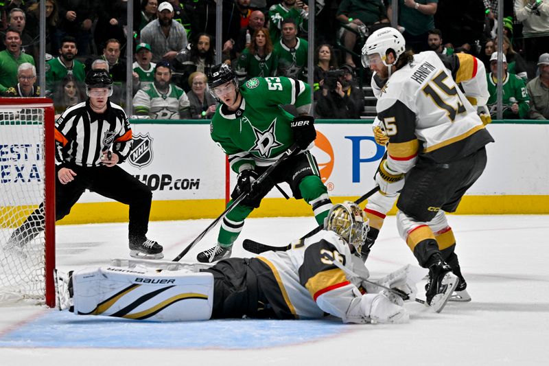 Apr 24, 2024; Dallas, Texas, USA; Vegas Golden Knights goaltender Logan Thompson (36) stops a shot by Dallas Stars center Wyatt Johnston (53) as defenseman Noah Hanifin (15) looks on during the second period in game two of the first round of the 2024 Stanley Cup Playoffs at American Airlines Center. Mandatory Credit: Jerome Miron-USA TODAY Sports