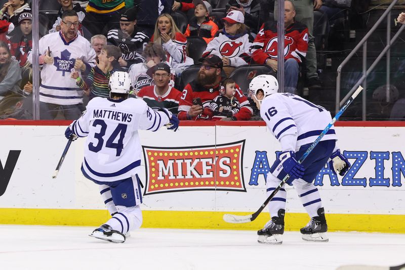 Mar 7, 2023; Newark, New Jersey, USA; Toronto Maple Leafs center Auston Matthews (34) celebrates his goal against the New Jersey Devils during the third period at Prudential Center. Mandatory Credit: Ed Mulholland-USA TODAY Sports