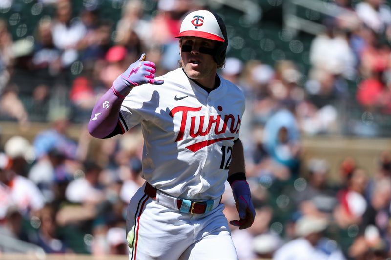 May 8, 2025; Minneapolis, Minnesota, USA; Minnesota Twins left fielder Harrison Bader (12) celebrates his walk against the Baltimore Orioles during the eighth inning at Target Field. Mandatory Credit: Matt Krohn-Imagn Images