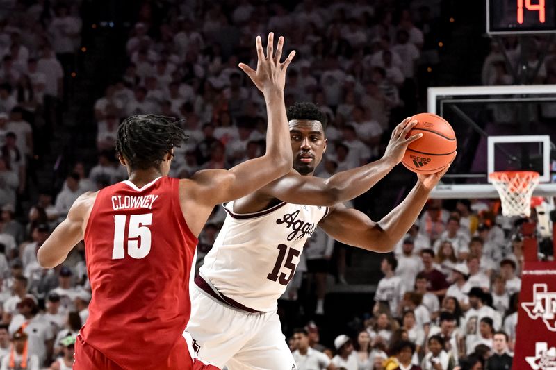 Mar 4, 2023; College Station, Texas, USA; Texas A&M Aggies forward Henry Coleman III (15) controls the ball against Alabama Crimson Tide forward Noah Clowney (15) during the second half against the Alabama Crimson Tide