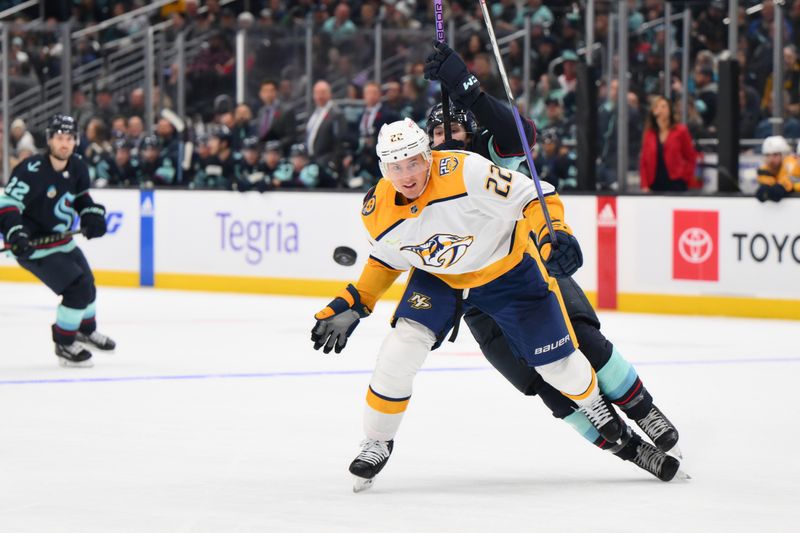 Nov 2, 2023; Seattle, Washington, USA; Nashville Predators defenseman Tyson Barrie (22) blocks Seattle Kraken left wing Tye Kartye (52) from the puck during the third period at Climate Pledge Arena. Mandatory Credit: Steven Bisig-USA TODAY Sports