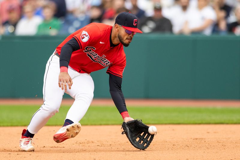 Apr 14, 2024; Cleveland, Ohio, USA; Cleveland Guardians first baseman Gabriel Arias (13) fields a ground ball for the first out of the ninth inning against the New York Yankees at Progressive Field. Mandatory Credit: Scott Galvin-USA TODAY Sports