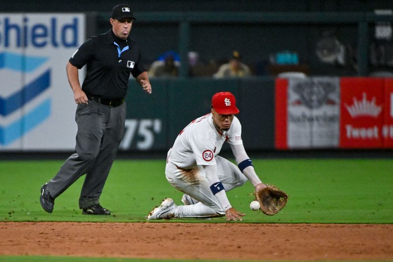 Aug 28, 2024; St. Louis, Missouri, USA;  St. Louis Cardinals shortstop Masyn Winn (0) fields a ground ball against the San Diego Padres during the eighth inning at Busch Stadium. Mandatory Credit: Jeff Curry-USA TODAY Sports