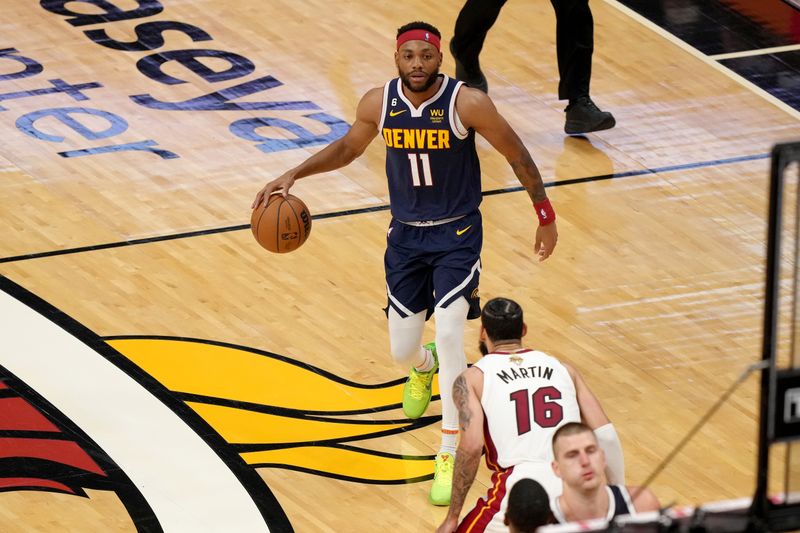 MIAMI, FL - JUNE 9: Bruce Brown #11 of the Denver Nuggets handles the ball during the game against the Miami Heat during Game Four of the 2023 NBA Finals on June 9, 2023 at Kaseya Center in Miami, Florida. NOTE TO USER: User expressly acknowledges and agrees that, by downloading and or using this Photograph, user is consenting to the terms and conditions of the Getty Images License Agreement. Mandatory Copyright Notice: Copyright 2023 NBAE (Photo by Eric Espada/NBAE via Getty Images)