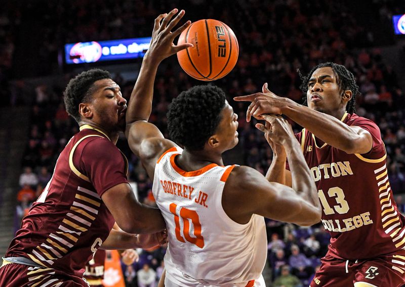 Jan 13, 2024; Clemson, South Carolina, USA; Clemson Tigers forward RJ Godfrey (10) battles for a rebound against Boston College Eagles guard Donald Hand (13) during the first half at Littlejohn Coliseum. Mandatory Credit: Ken Ruinard-USA TODAY Sports