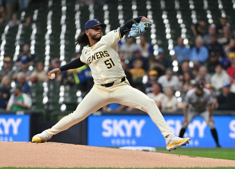 Aug 28, 2024; Milwaukee, Wisconsin, USA; Milwaukee Brewers pitcher Freddy Peralta (51) delivers a pitch against the San Francisco Giants in the first inning at American Family Field. Mandatory Credit: Michael McLoone-USA TODAY Sports