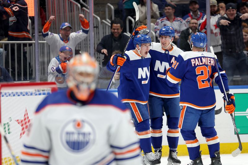 Dec 19, 2023; Elmont, New York, USA; New York Islanders center Bo Horvat (14) celebrates his goal against Edmonton Oilers goaltender Stuart Skinner (74) with center Brock Nelson (29) and center Kyle Palmieri (21) during the second period at UBS Arena. Mandatory Credit: Brad Penner-USA TODAY Sports