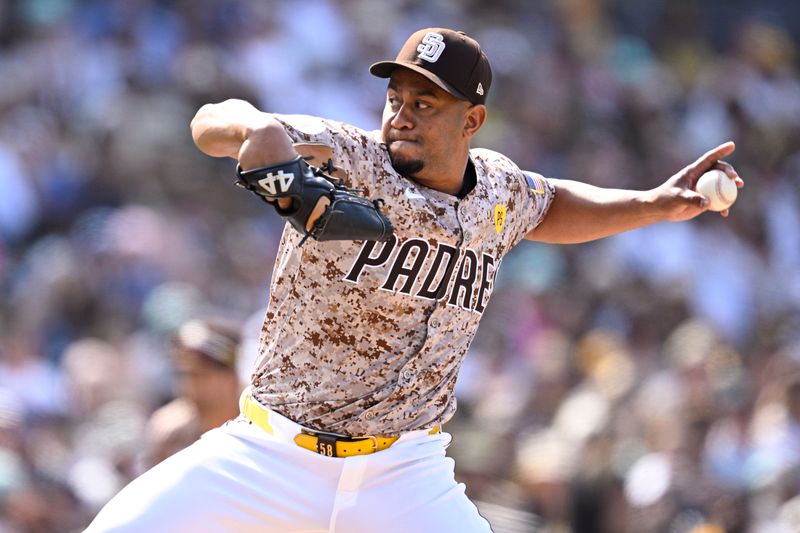 Apr 21, 2024; San Diego, California, USA; San Diego Padres relief pitcher Wandy Peralta (58) throws a pitch against the Toronto Blue Jays during the eighth inning at Petco Park. Mandatory Credit: Orlando Ramirez-USA TODAY Sports