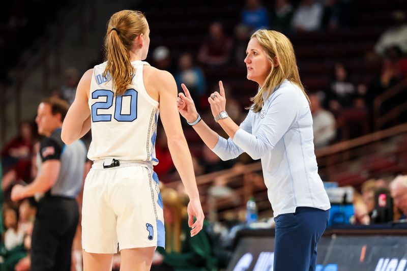 Mar 22, 2024; Columbia, SC, USA; North Carolina Tar Heels head coach Courtney Banghart speaks with guard Lexi Donarski (20) in the first half at Colonial Life Arena. Mandatory Credit: Jeff Blake-USA TODAY Sports