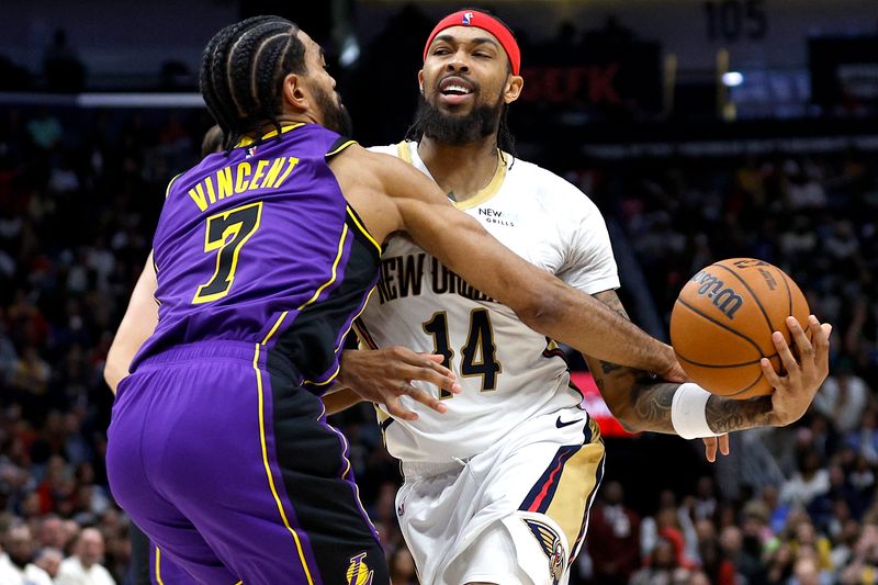 NEW ORLEANS, LOUISIANA - NOVEMBER 16: Brandon Ingram #14 of the New Orleans Pelicans is fouled by Gabe Vincent #7 of the Los Angeles Lakers during the fourth quarter of an NBA game at Smoothie King Center on November 16, 2024 in New Orleans, Louisiana. NOTE TO USER: User expressly acknowledges and agrees that, by downloading and or using this photograph, User is consenting to the terms and conditions of the Getty Images License Agreement. (Photo by Sean Gardner/Getty Images)