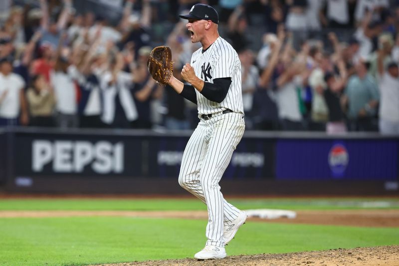 Jun 19, 2024; Bronx, New York, USA;  New York Yankees pitcher Anthony Misiewicz (58) reacts after the third out in the ninth inning against the Baltimore Orioles at Yankee Stadium. Mandatory Credit: Wendell Cruz-USA TODAY Sports