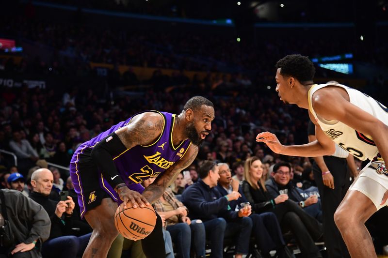 LOS ANGELES, CA - FEBRUARY 9:  LeBron James #23 of the Los Angeles Lakers handles the ball during the game against the New Orleans Pelicans on February 9, 2024 at Crypto.Com Arena in Los Angeles, California. NOTE TO USER: User expressly acknowledges and agrees that, by downloading and/or using this Photograph, user is consenting to the terms and conditions of the Getty Images License Agreement. Mandatory Copyright Notice: Copyright 2024 NBAE (Photo by Adam Pantozzi/NBAE via Getty Images)