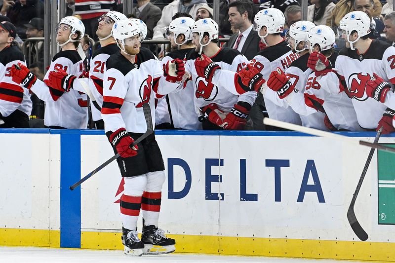 Dec 2, 2024; New York, New York, USA;  New Jersey Devils defenseman Dougie Hamilton (7) celebrates his goal against the New York Rangers during the second period at Madison Square Garden. Mandatory Credit: Dennis Schneidler-Imagn Images