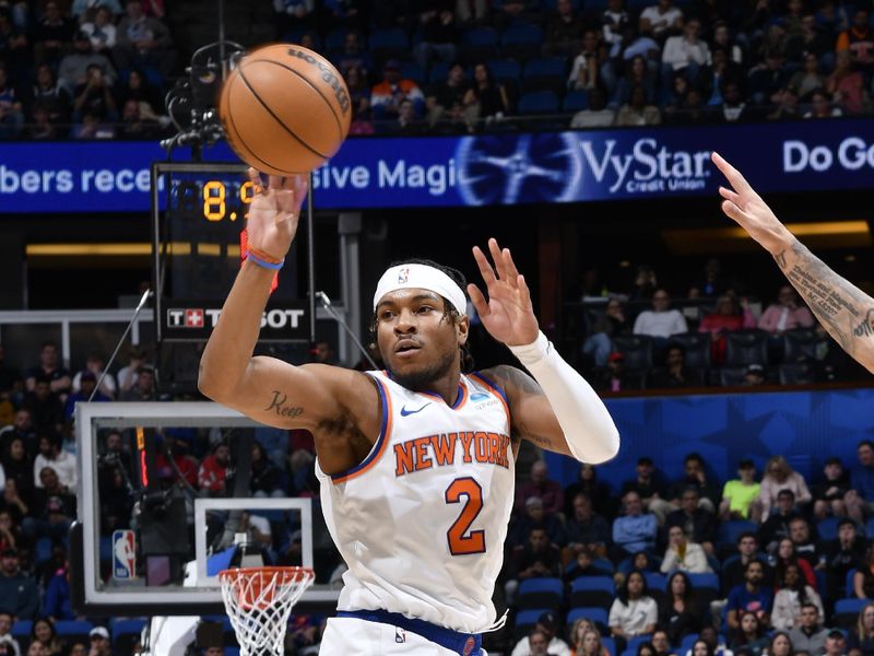 ORLANDO, FL - FEBRUARY 14: Miles McBride #2 of the New York Knicks passes the ball during the game against the Orlando Magic on February 14, 2024 at the Kia Center in Orlando, Florida. NOTE TO USER: User expressly acknowledges and agrees that, by downloading and or using this photograph, User is consenting to the terms and conditions of the Getty Images License Agreement. Mandatory Copyright Notice: Copyright 2024 NBAE (Photo by Gary Bassing/NBAE via Getty Images)