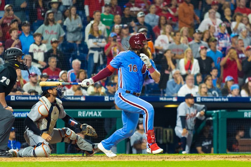 Jun 8, 2023; Philadelphia, Pennsylvania, USA; Philadelphia Phillies center fielder Brandon Marsh (16) hits an RBI sacrifice fly during the ninth inning against the Detroit Tigers at Citizens Bank Park. Mandatory Credit: Bill Streicher-USA TODAY Sports