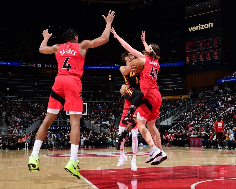 ATLANTA, GA - February 23:  Kelly Olynyk #41 of the Toronto Raptors plays defense against Trae Young #11 of the Atlanta Hawks on February 23, 2024 at State Farm Arena in Atlanta, Georgia.  NOTE TO USER: User expressly acknowledges and agrees that, by downloading and/or using this Photograph, user is consenting to the terms and conditions of the Getty Images License Agreement. Mandatory Copyright Notice: Copyright 2024 NBAE (Photo by Scott Cunningham/NBAE via Getty Images)