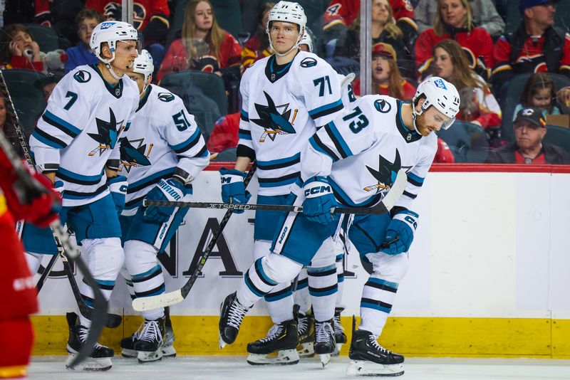 Apr 12, 2023; Calgary, Alberta, CAN; San Jose Sharks center Noah Gregor (73) celebrates his goal with teammates against the Calgary Flames during the first period at Scotiabank Saddledome. Mandatory Credit: Sergei Belski-USA TODAY Sports