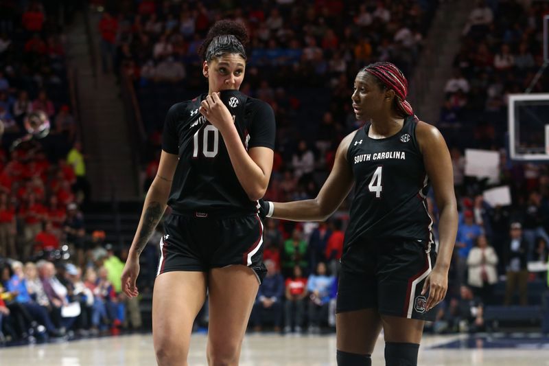 Feb 19, 2023; Oxford, Mississippi, USA; South Carolina Gamecocks center Kamilla Cardoso (10) and forward Aliyah Boston (4) talk during a timeout during the second half against the Mississippi Rebels at The Sandy and John Black Pavilion at Ole Miss. Mandatory Credit: Petre Thomas-USA TODAY Sports